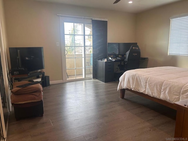 bedroom featuring hardwood / wood-style flooring and access to outside