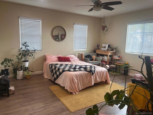 bedroom featuring hardwood / wood-style floors and ceiling fan