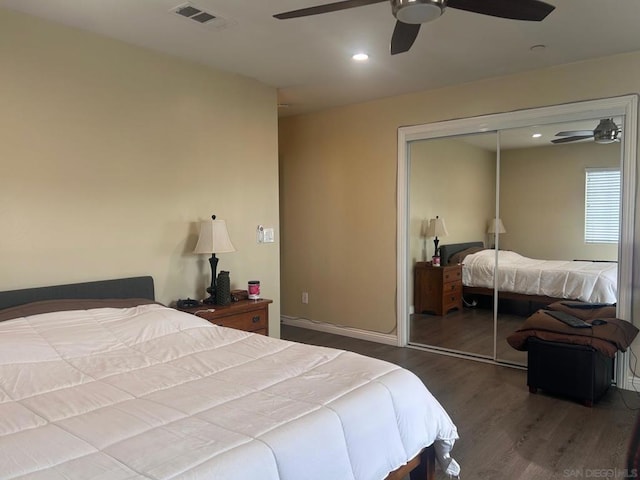 bedroom with ceiling fan, hardwood / wood-style floors, and a closet