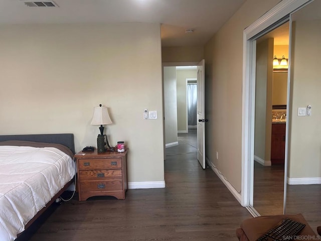 bedroom featuring dark wood-type flooring