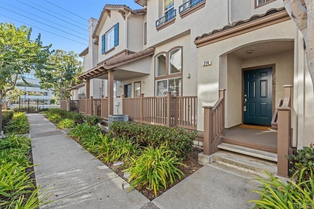 doorway to property with cooling unit