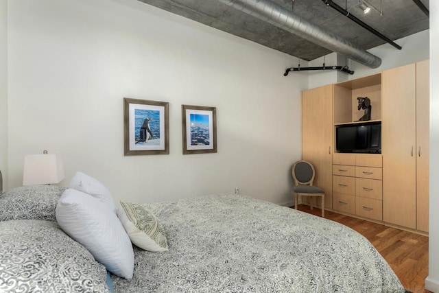 bedroom featuring hardwood / wood-style flooring