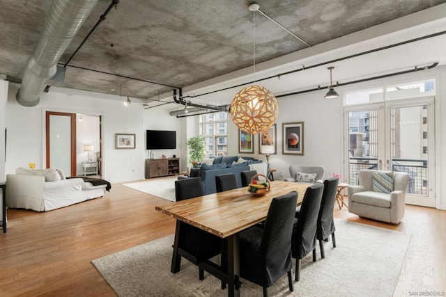 dining area featuring light hardwood / wood-style floors and french doors