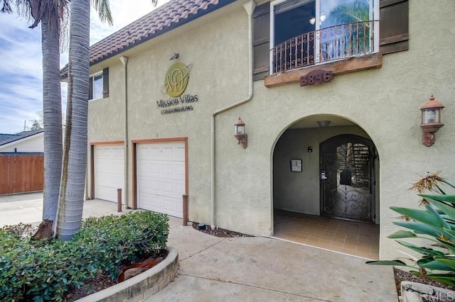 exterior space with a balcony and a garage