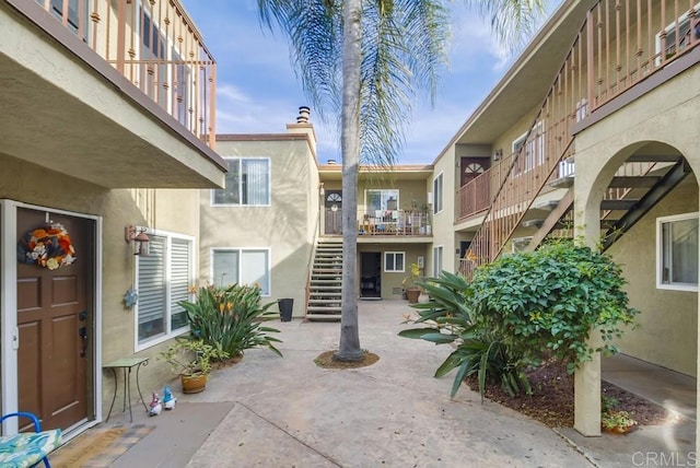 exterior space featuring a patio and stairway