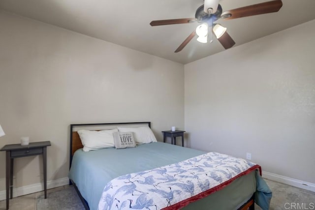 bedroom with ceiling fan and baseboards