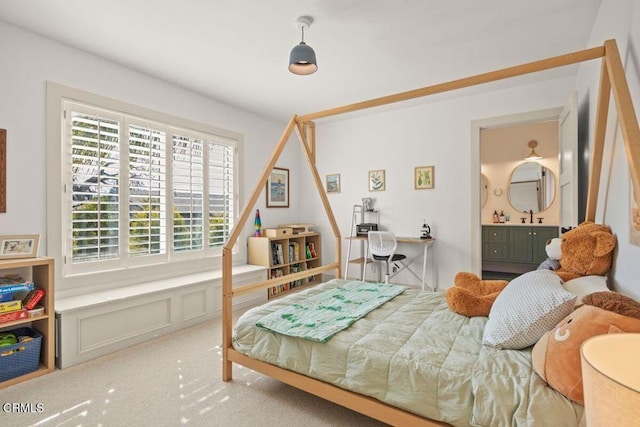 bedroom with sink and carpet