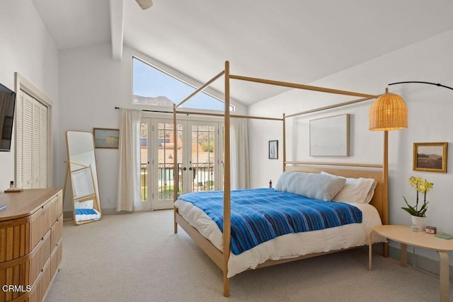 carpeted bedroom featuring lofted ceiling with beams, access to outside, and multiple windows