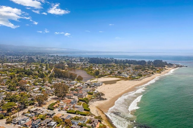 bird's eye view featuring a water view and a view of the beach