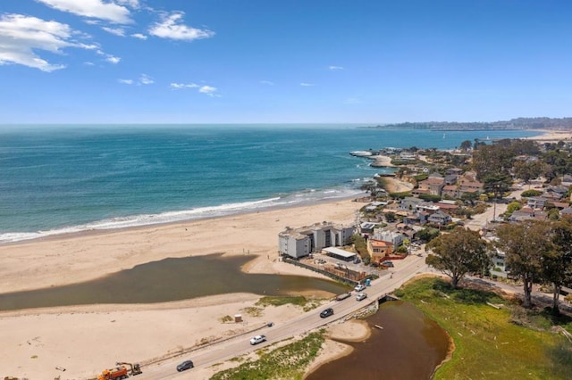 drone / aerial view with a view of the beach and a water view