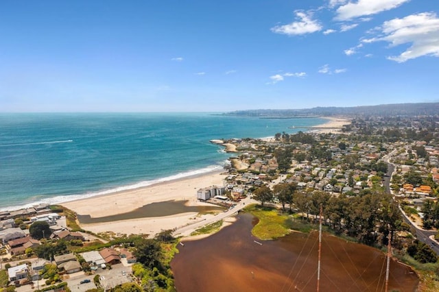 birds eye view of property featuring a water view and a view of the beach