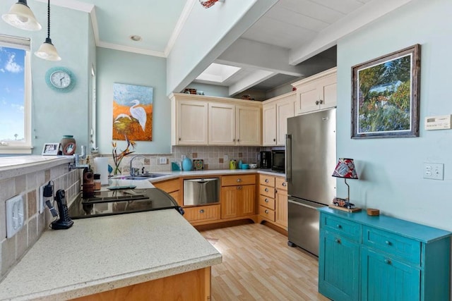 kitchen with stainless steel appliances, pendant lighting, backsplash, and light brown cabinetry