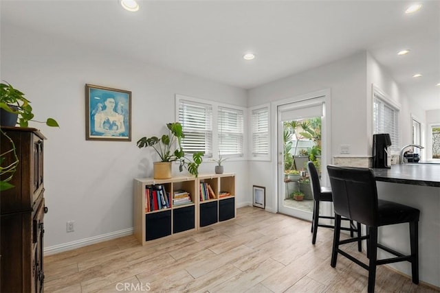 office area featuring light wood-style floors, recessed lighting, and baseboards