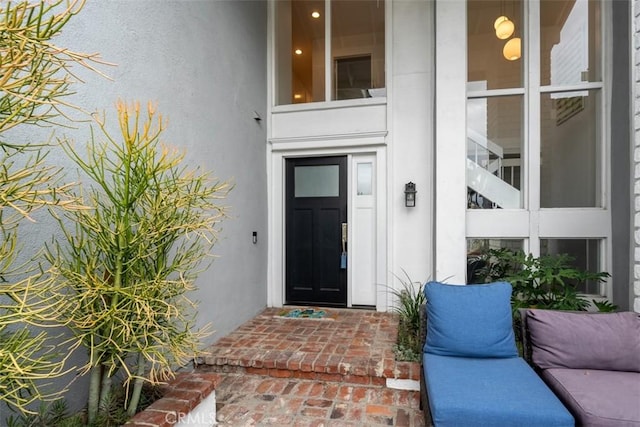 doorway to property with stucco siding