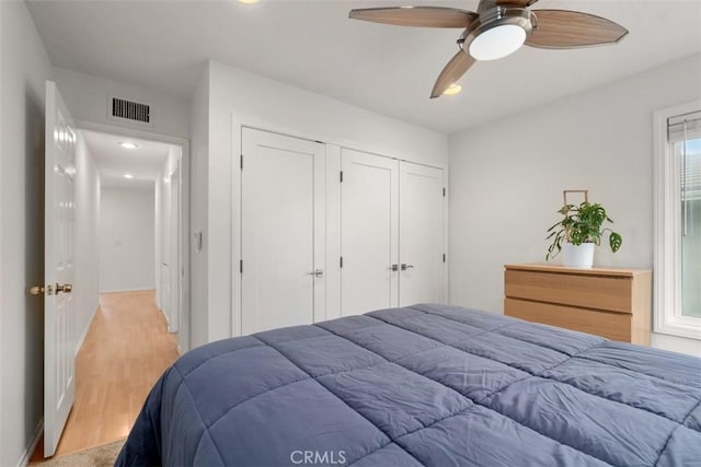 bedroom with recessed lighting, a closet, visible vents, a ceiling fan, and light wood-type flooring