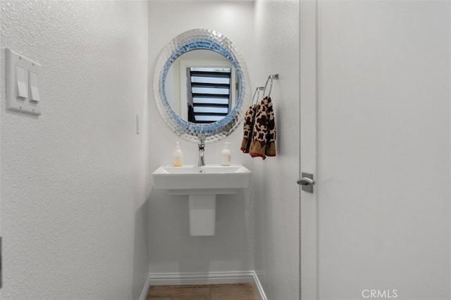 bathroom with baseboards