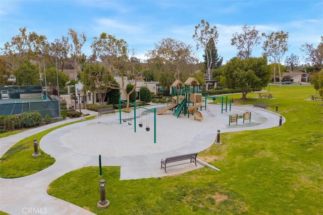 view of property's community with a residential view, playground community, and a lawn