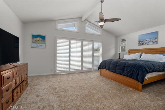 carpeted bedroom with lofted ceiling with beams and ceiling fan