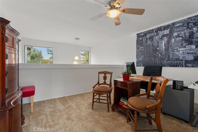 sitting room featuring light carpet and ceiling fan