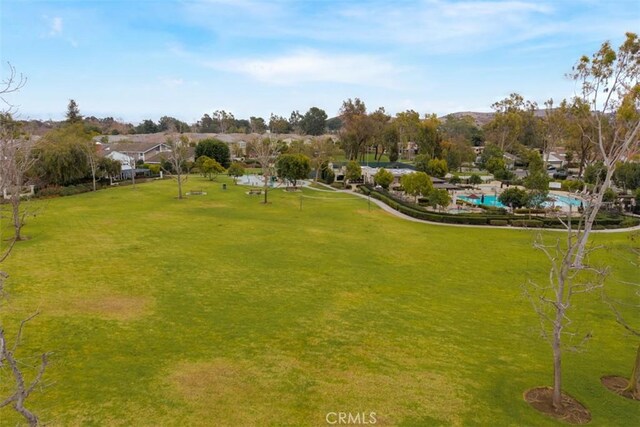 view of home's community featuring a lawn