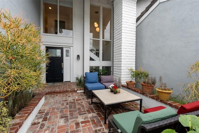 doorway to property featuring a patio area