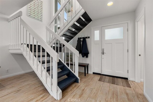 foyer entrance with light hardwood / wood-style flooring