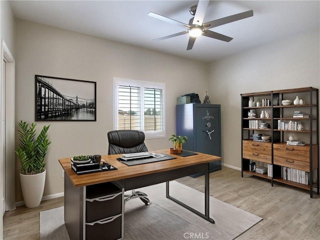 office space with light hardwood / wood-style flooring and ceiling fan