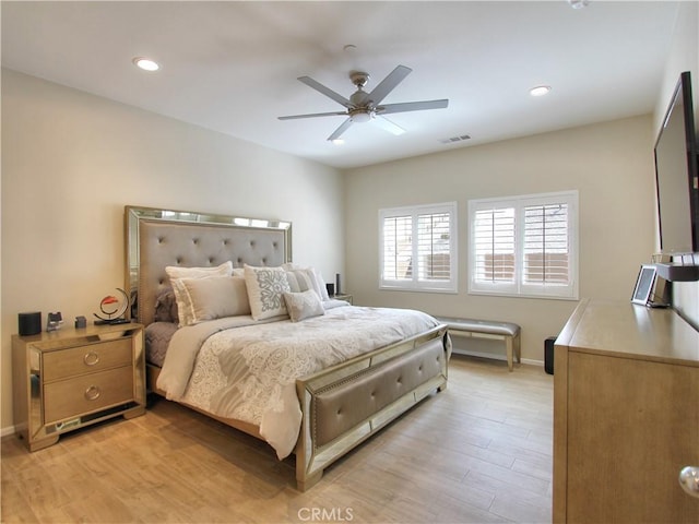 bedroom featuring ceiling fan and light wood-type flooring