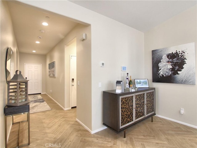 hallway featuring light parquet flooring