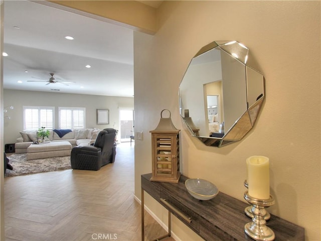 interior space with ceiling fan and parquet flooring