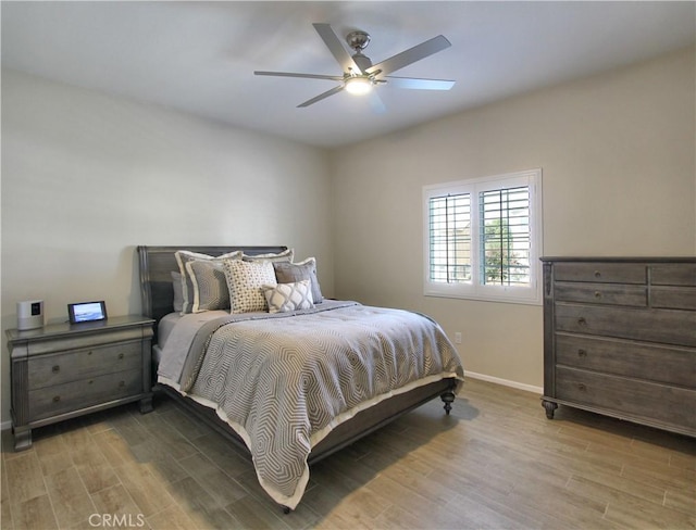 bedroom featuring wood-type flooring and ceiling fan