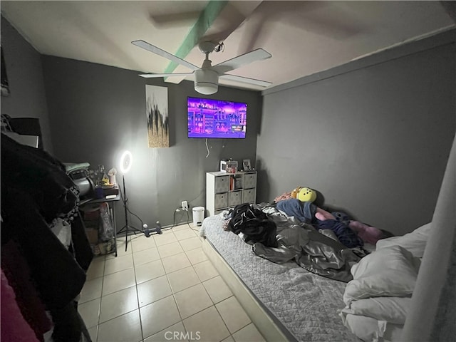 tiled bedroom with ceiling fan