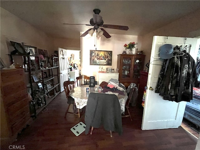 dining area featuring dark wood-type flooring and ceiling fan