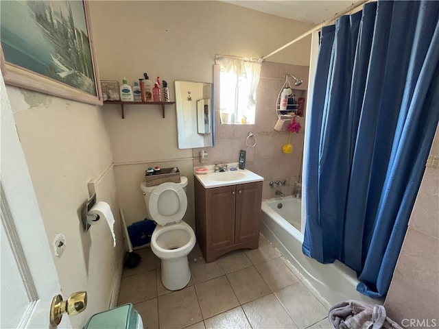 full bathroom featuring tile patterned flooring, vanity, shower / bathtub combination with curtain, and toilet