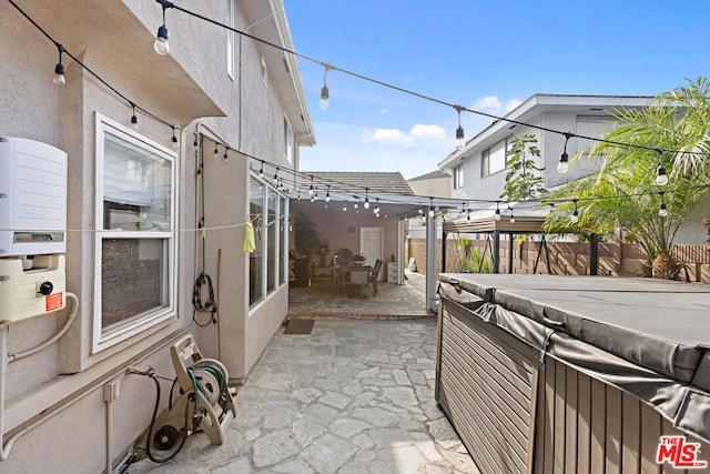 view of patio / terrace with a hot tub