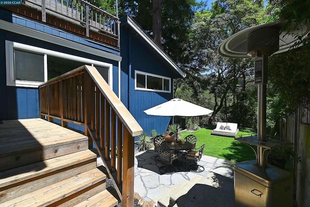 deck with a yard and a patio area