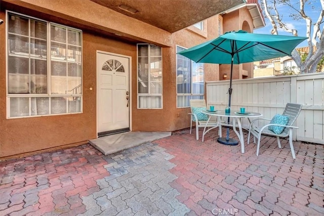 doorway to property with a patio area