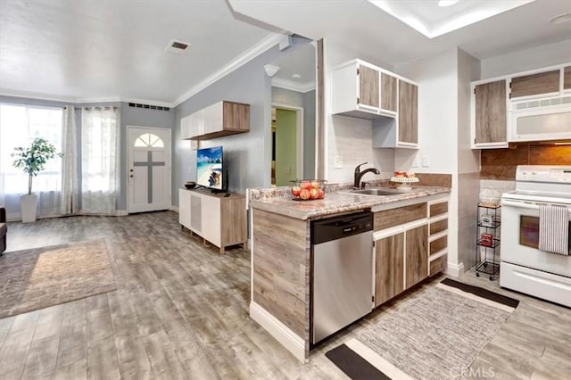 kitchen with ornamental molding, sink, white appliances, and light hardwood / wood-style flooring