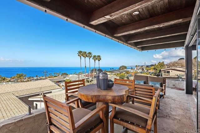 view of patio featuring a water view