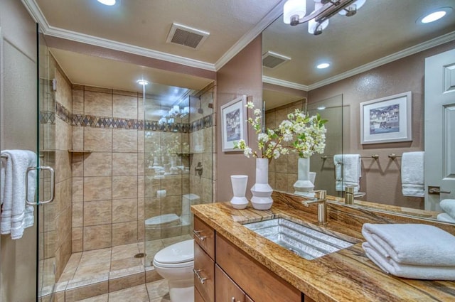 bathroom with an enclosed shower, vanity, crown molding, and toilet