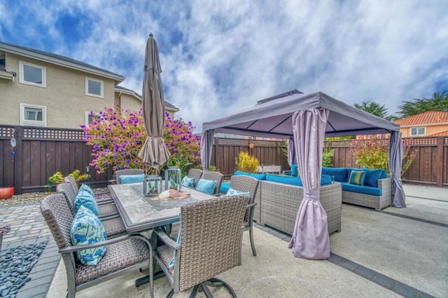 view of patio / terrace with an outdoor living space and a gazebo