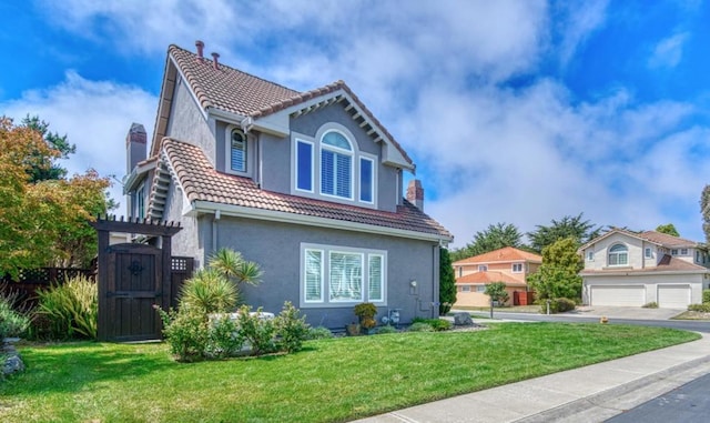 view of front of home with a front lawn