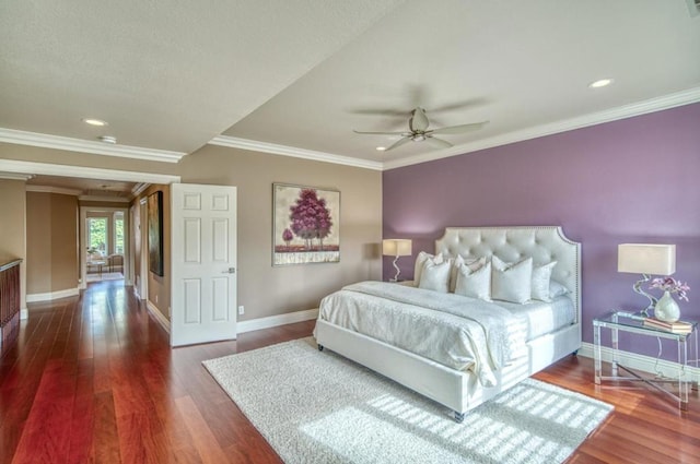 bedroom featuring ornamental molding, dark hardwood / wood-style floors, and ceiling fan