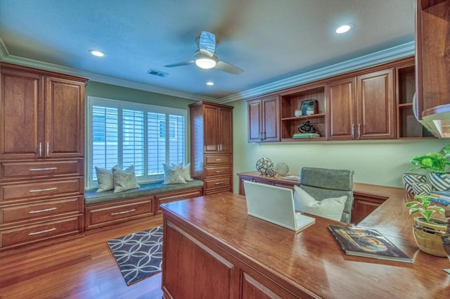 office area with crown molding, ceiling fan, and light wood-type flooring