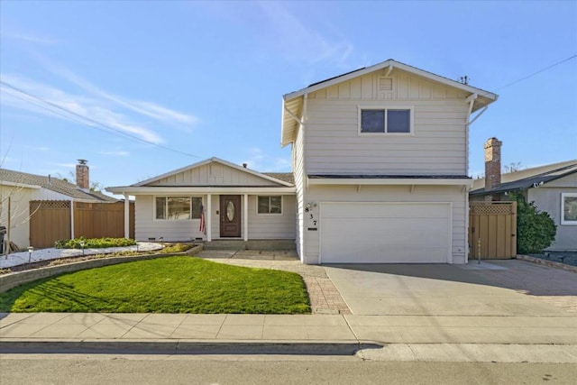 front of property with a garage and a front yard