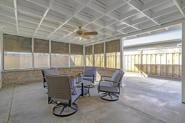 sunroom / solarium featuring ceiling fan