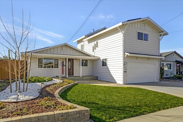 view of front of property with a garage and a front yard