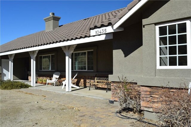 rear view of house featuring a patio area