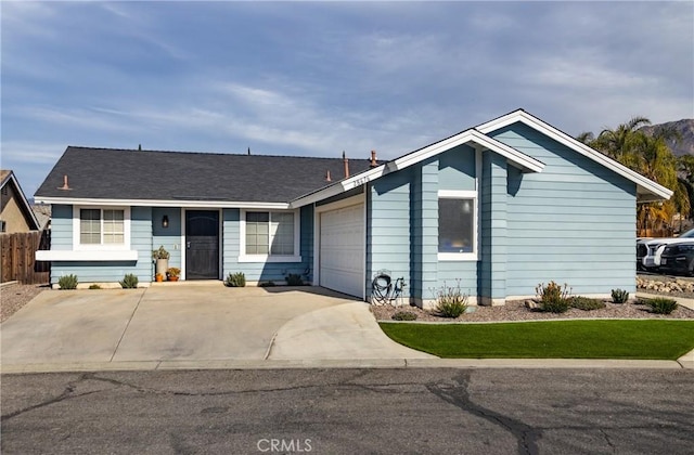 ranch-style home featuring a garage