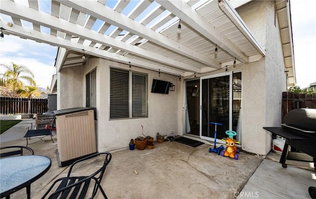 view of patio featuring grilling area and a pergola